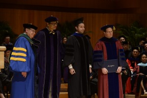 Yuval Bar-Or receiving Excellence in Teaching Award at Johns Hopkins Carey Business School Graduation 2015